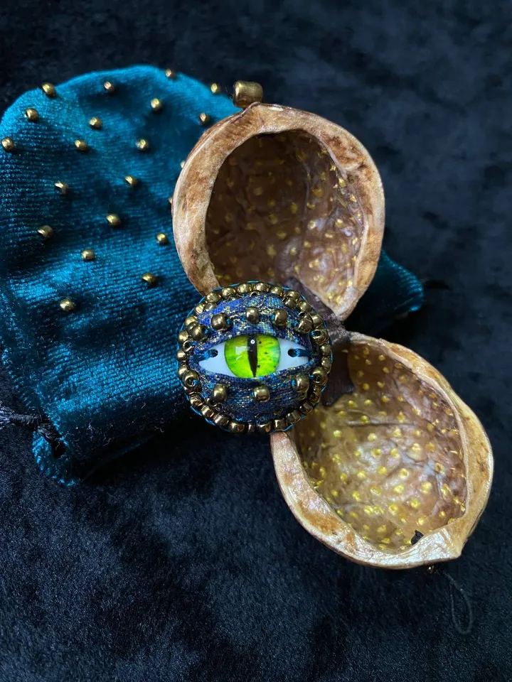 Green dragon eye brooch in walnut shell, green eye badge
