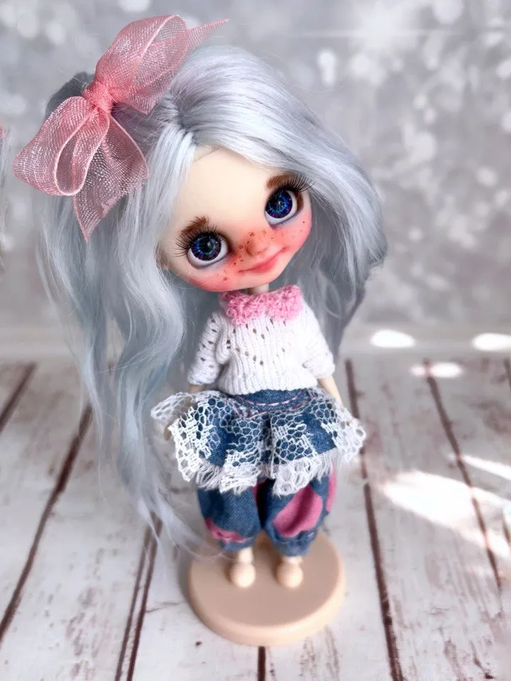 Small Blythe doll with blue eyes. Beautiful miniature Blythe doll with blue hair.