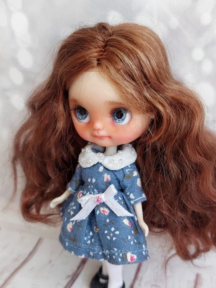 Charming little girl with brown hair and blue eyes. Author's miniature doll for your collection.