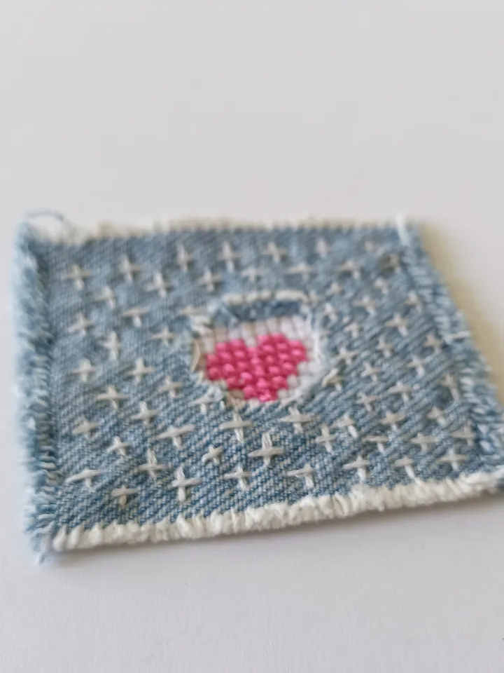 Upcycled denim boro patch. Sashiko stitching.
