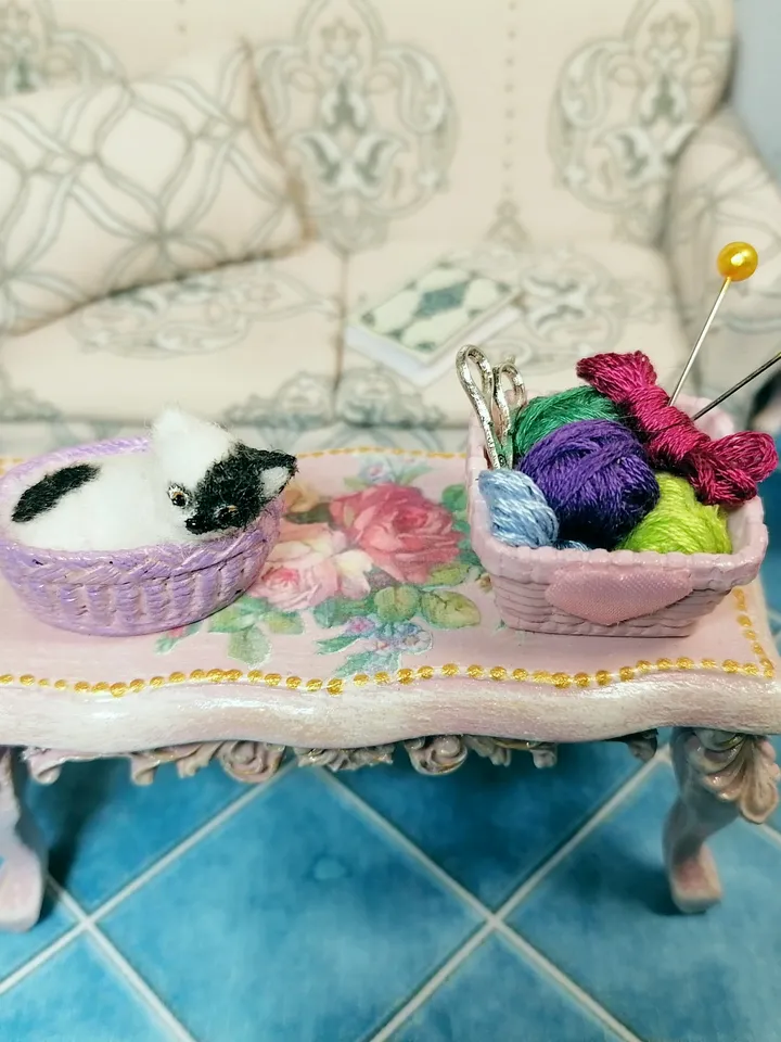 Cat in a basket. Dollhouse miniature.