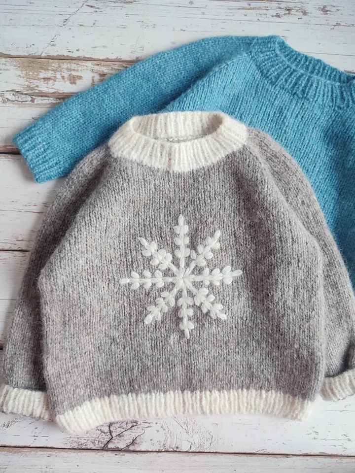 Children's sweater made of alpaka wool with snowflake embroidery