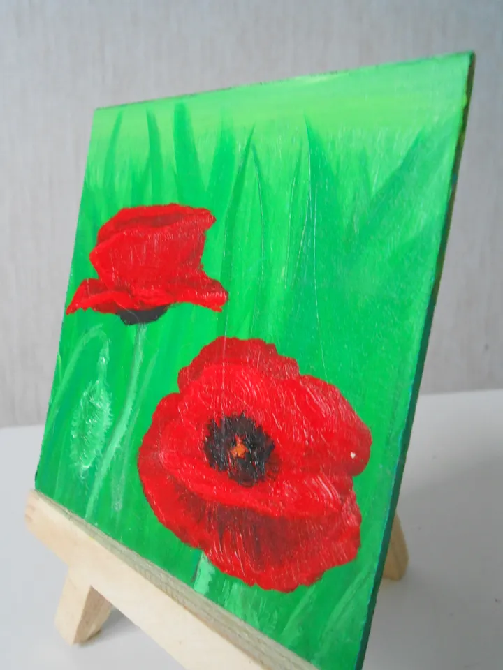 Poppies.Red flowers.A bright miniature of a poppy with oil paints.