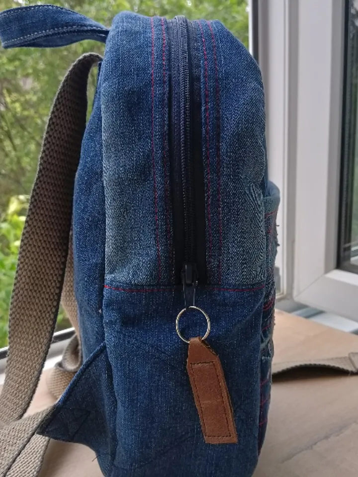 Stylish HANDMADE denim BACKPACK WITH a DEEP POCKET IN THE FRONT IN the lazy boro Patchwork STYLE and lined with red plai