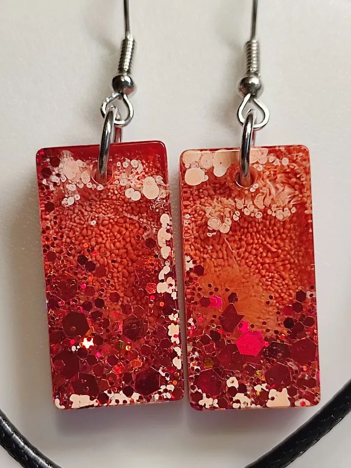 Jewelry set earrings and pendant in orange color