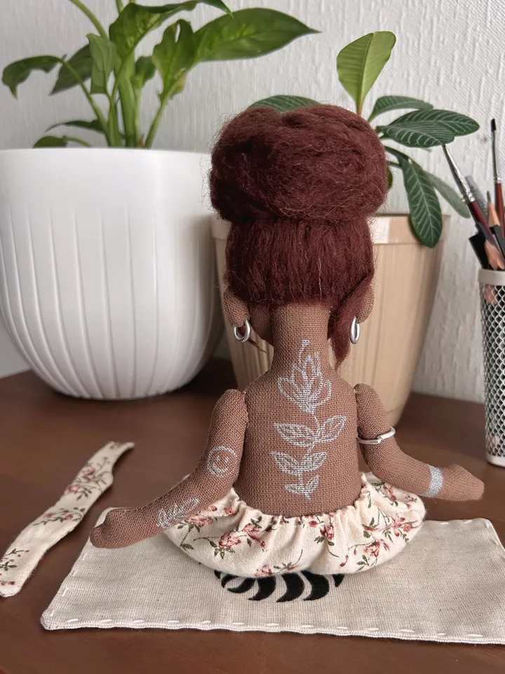 Textile doll yoga girl with dark hair and tattoo