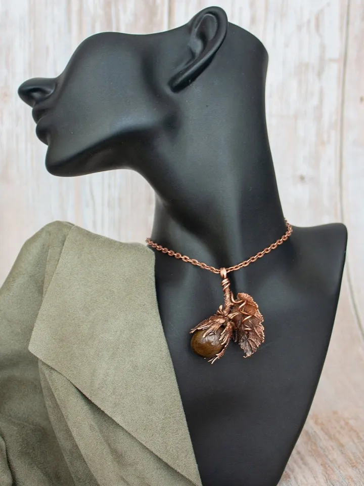 Unique handmade electroformed pendant made of natural leaves and twigs with natural tiger eye stone