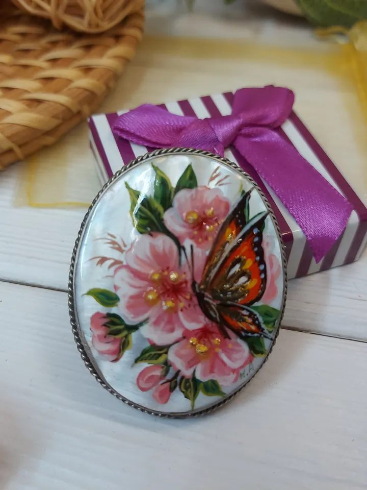 Brooches for women: A delicate butterfly on wild rose blossoms mother of pearl pin, hand painted pink floral brooch made from shell