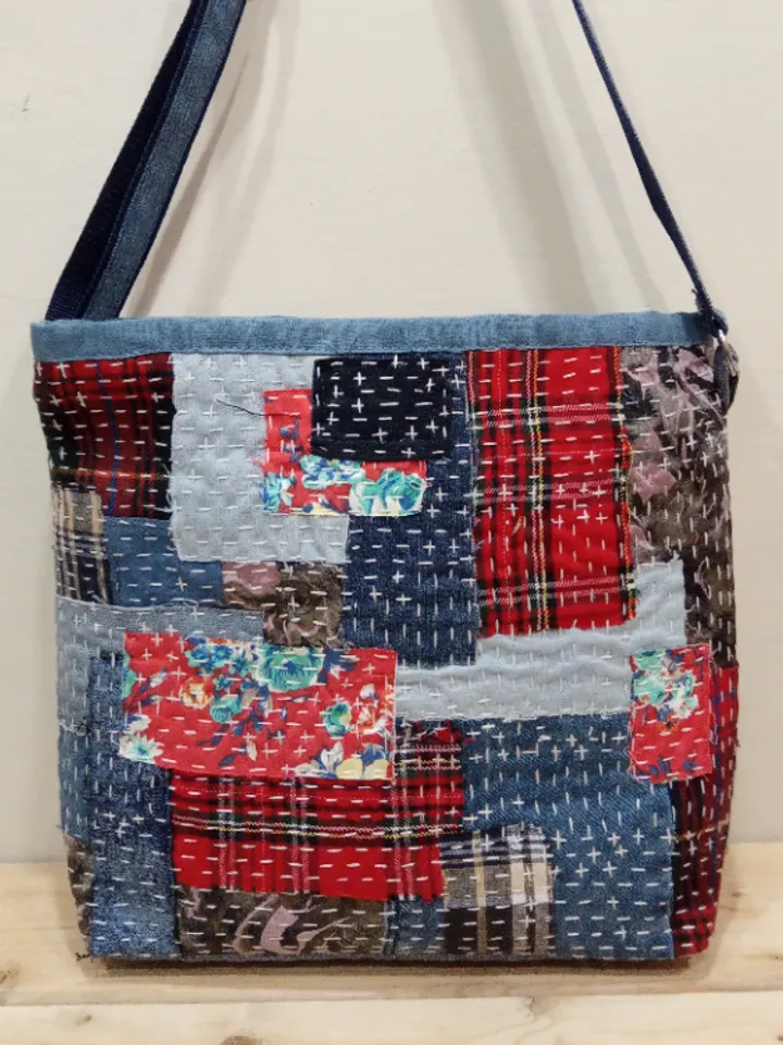 Pretty quilted handbag in the patchwork and boro style made of pieces of denim and cotton