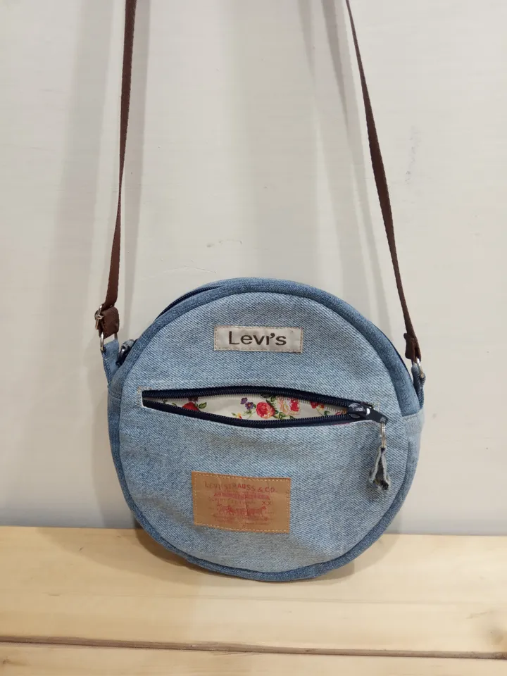 Round denim crossbody bag with a long strap