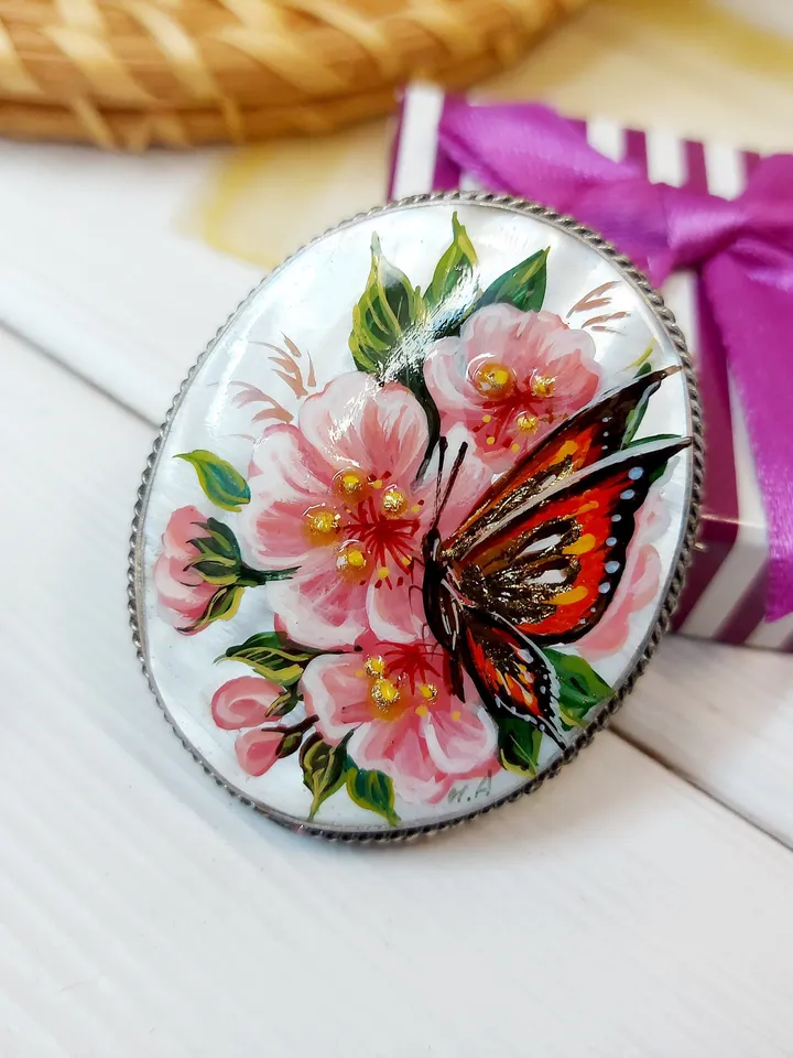 Brooches for women: A delicate butterfly on wild rose blossoms mother of pearl pin, hand painted pink floral brooch made from shell