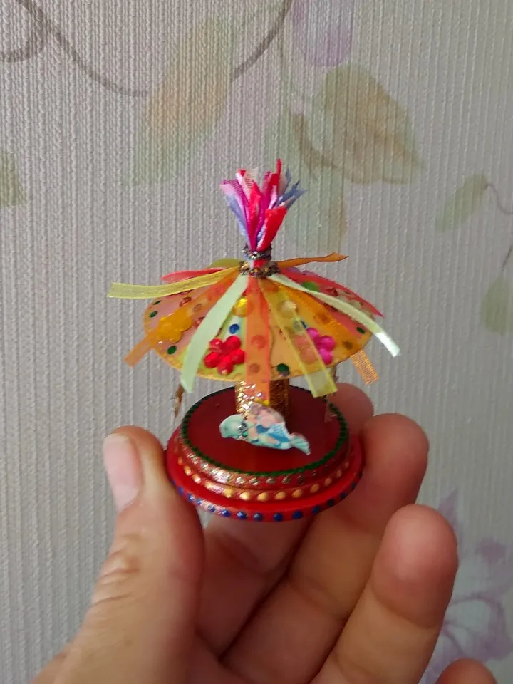 Miniature carousel. Dollhouse miniature.1:12 scale.