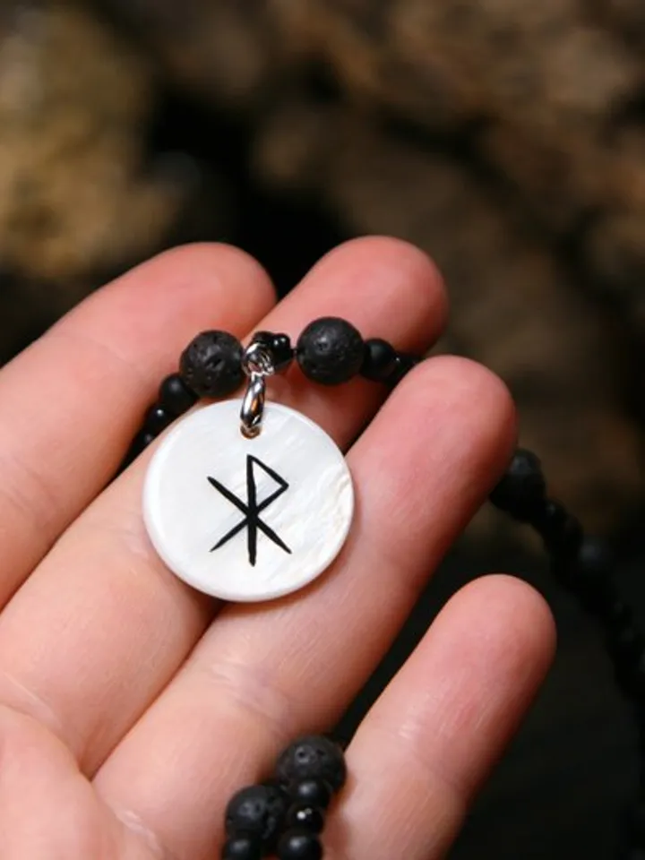 Raven or crow necklace with love rune on the other side. Nacre pearl pendant