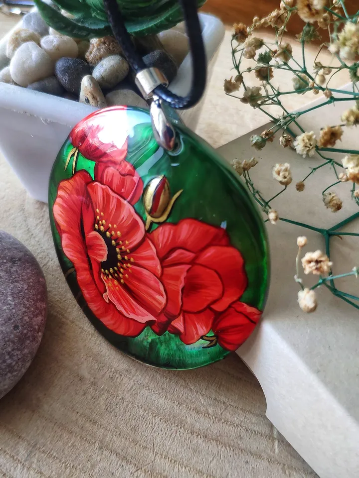 Floral Symphony: Captivating Red Poppy on Iridescent Green Nacre Pendant, a Stunning Blend of Nature and Artistry, Icon of Love and Passion