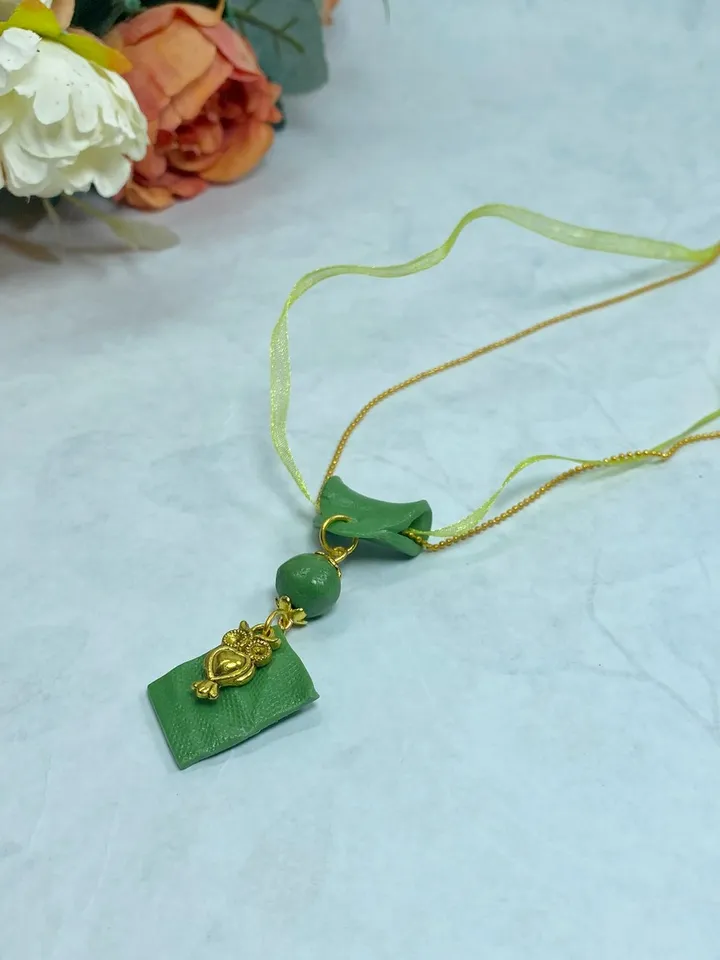 Handmade pendant on a chain. Handmade jewelry.
