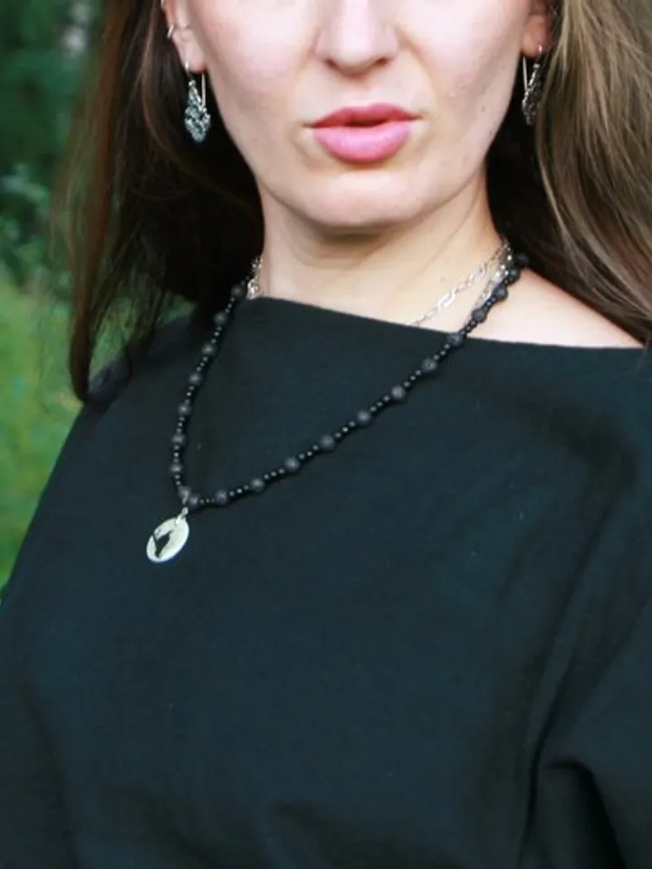 Raven or crow necklace with love rune on the other side. Nacre pearl pendant