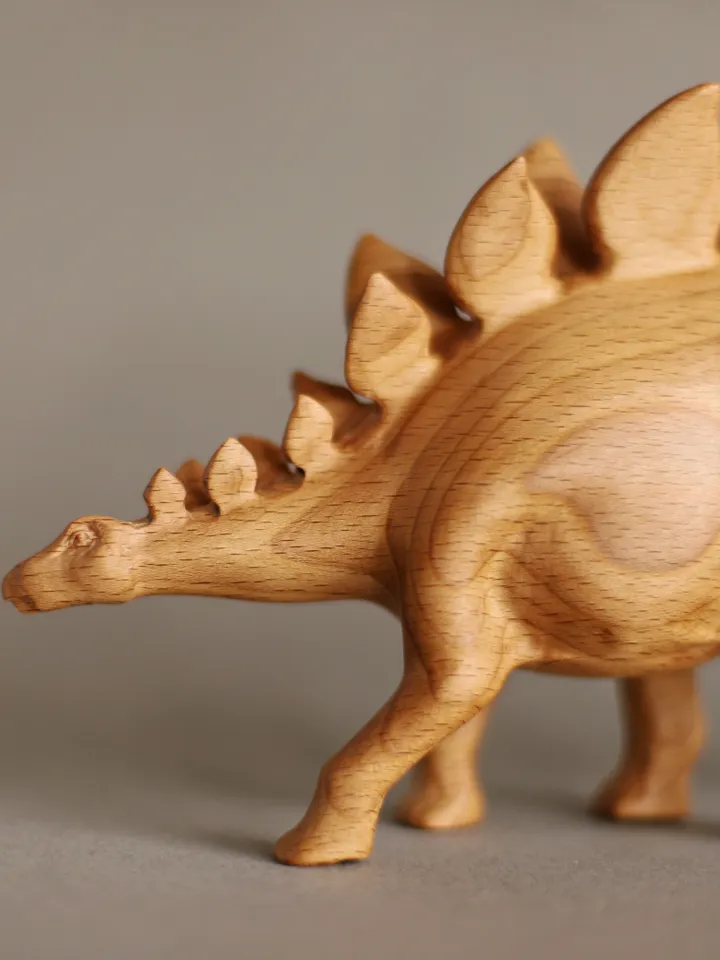 Wooden hand carved dinosaur stegosaurus
