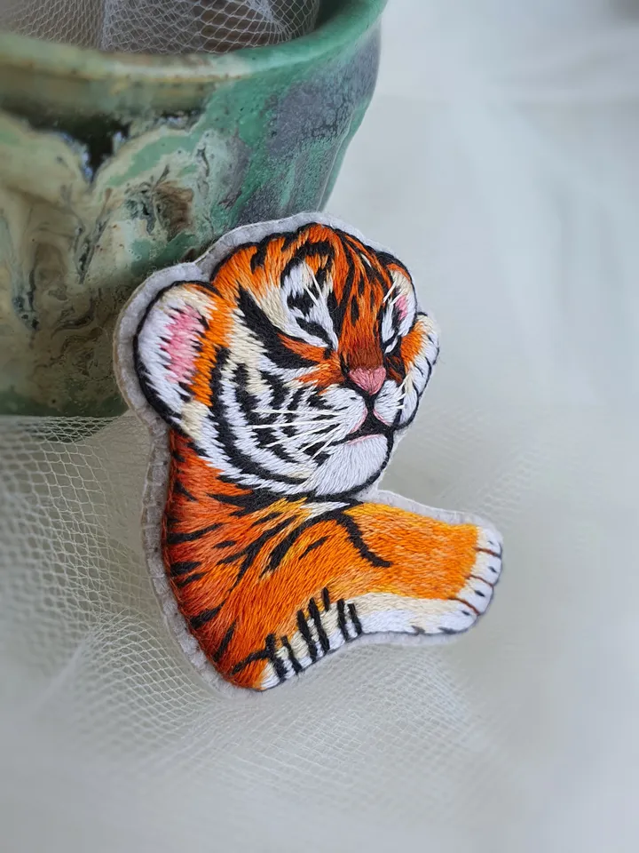 Sleeping Tiger Cub Brooch. Hand-embroidered with satin stitch