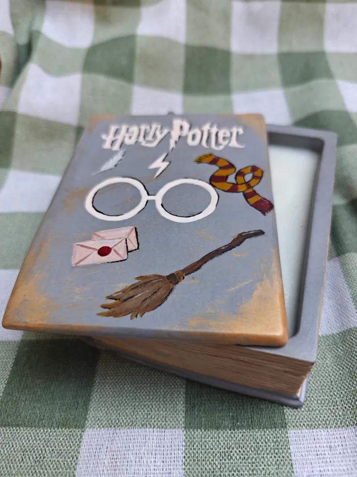 Candle in a plaster form of a book