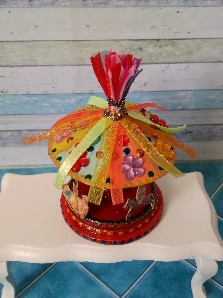Miniature carousel. Dollhouse miniature.1:12 scale.