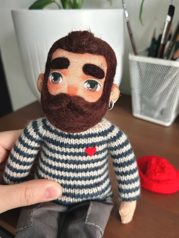 Textile doll sailor with tattoo in a dark blue striped sweater