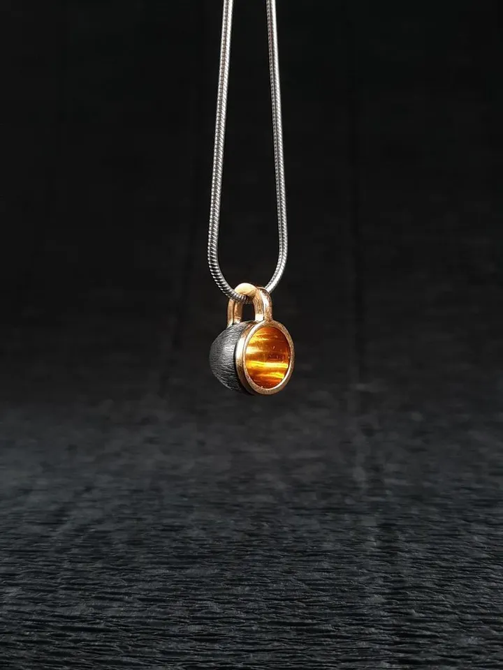 Pendant cup of coffee made of silver with gold plating.