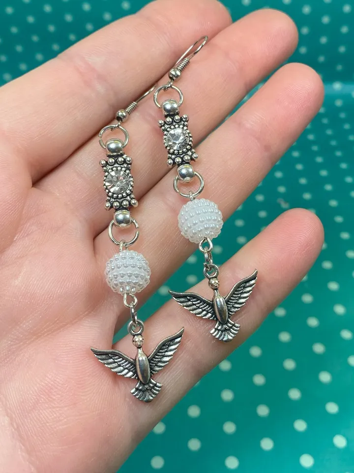 Handmade set. Handmade jewelry. Metal birds on a pendant. Handmade. Author's design.