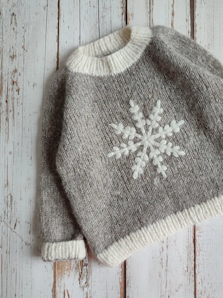 Children's sweater made of alpaka wool with snowflake embroidery