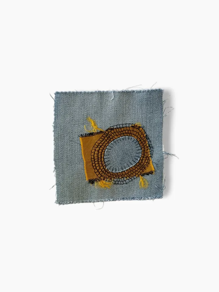 Upcycled denim boro patch. Sashiko stitching.