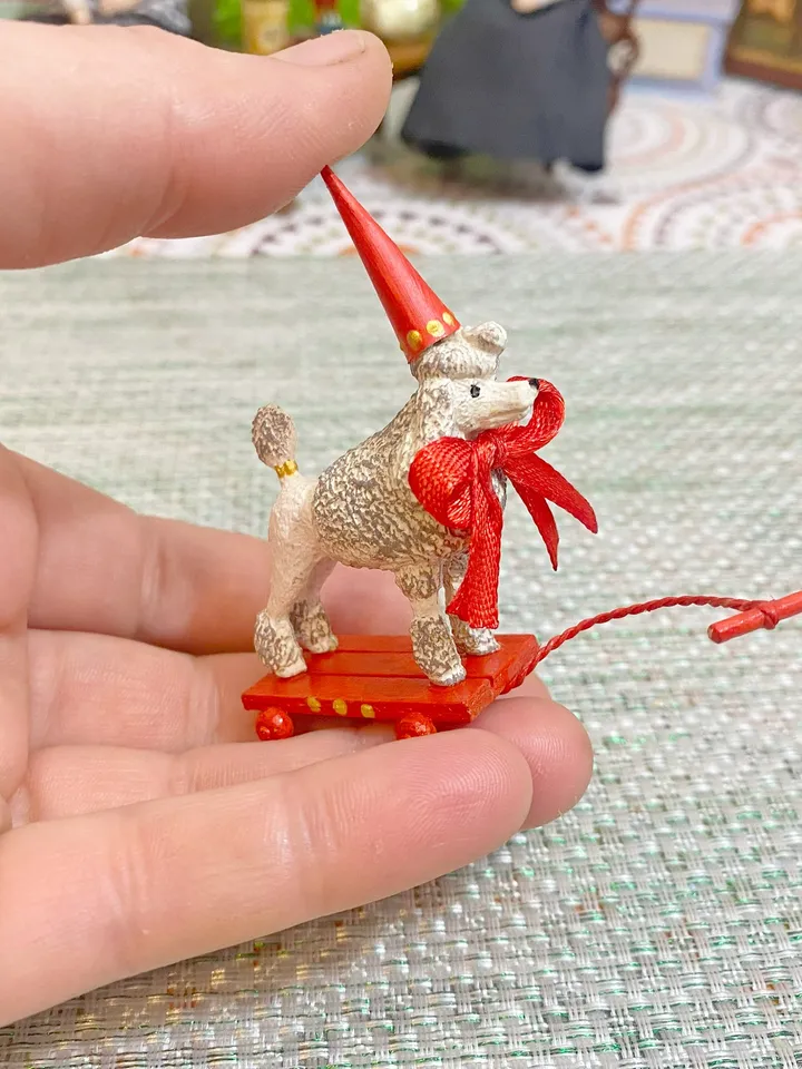 Poodle on a cart. Doll toy. Scale 1:12.