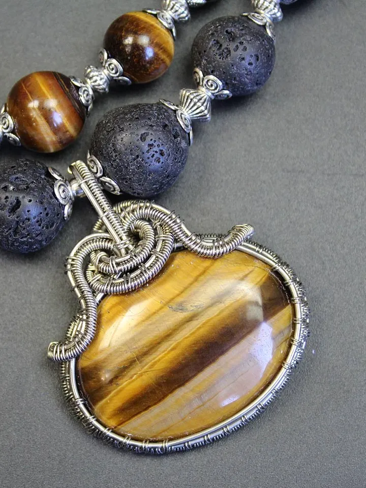 Necklace made of natural stones volcanic lava and tiger eye.