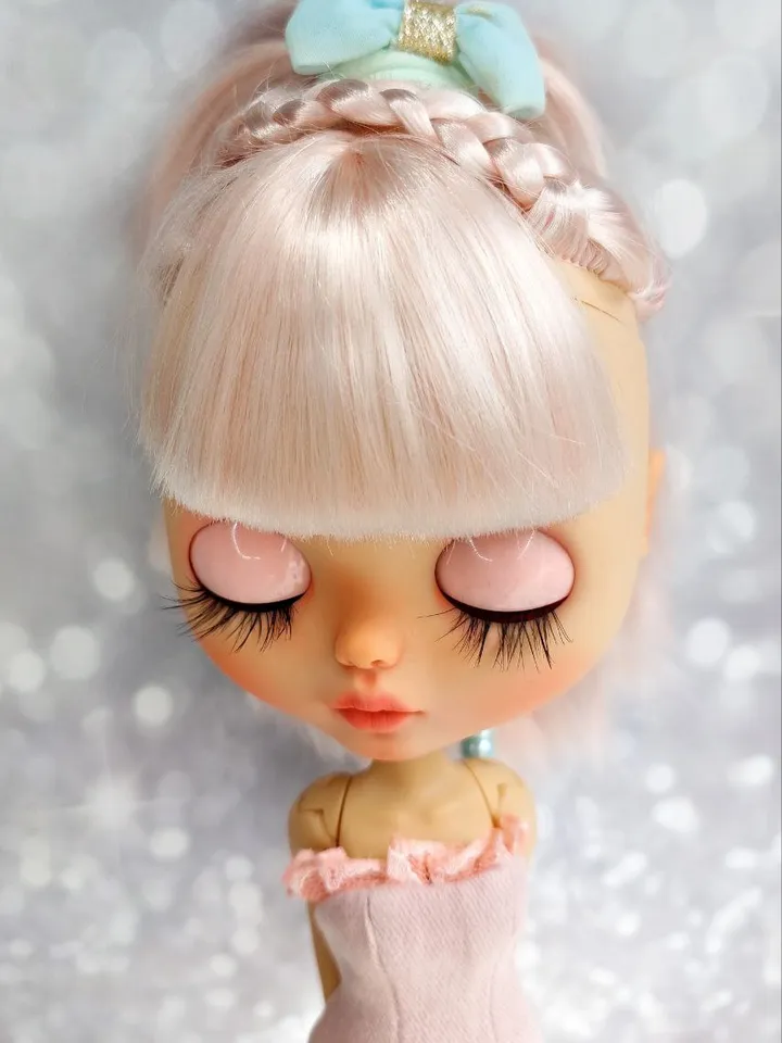 Lovely Blythe doll with delicate pink hair.