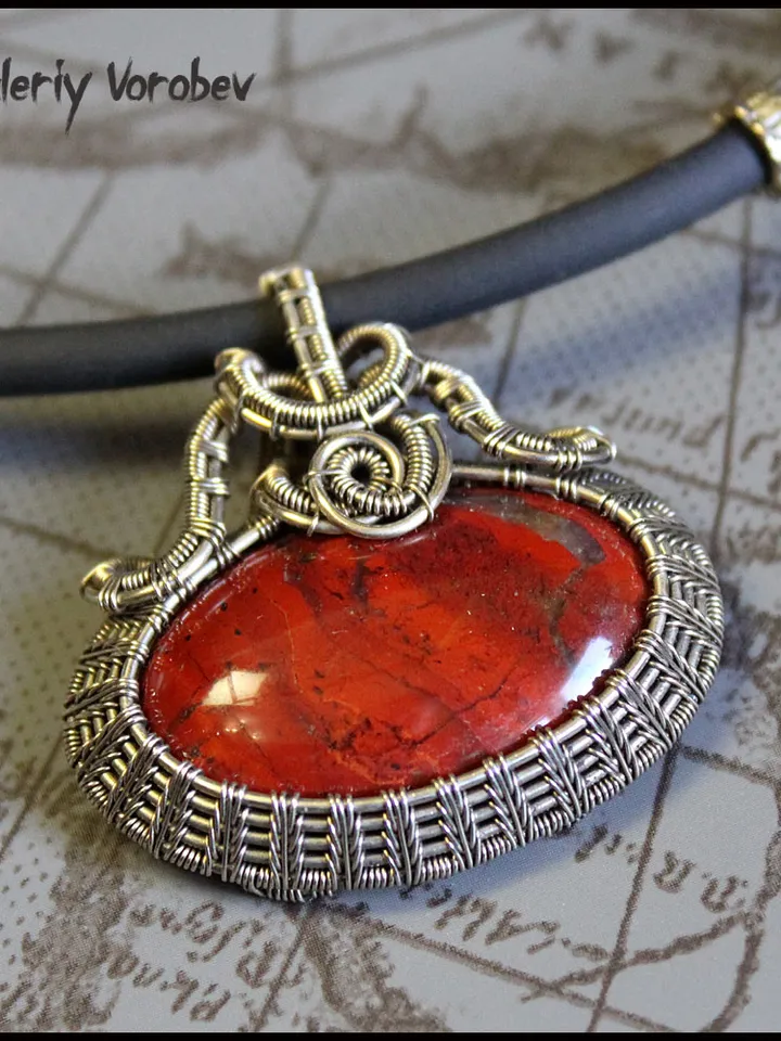 Handmade necklace with a pendant made of jasper and nickel silver wire.