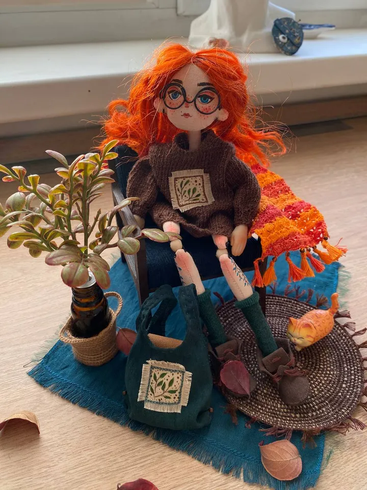 Red-haired doll with goblincore and cottagecore style with tattoos