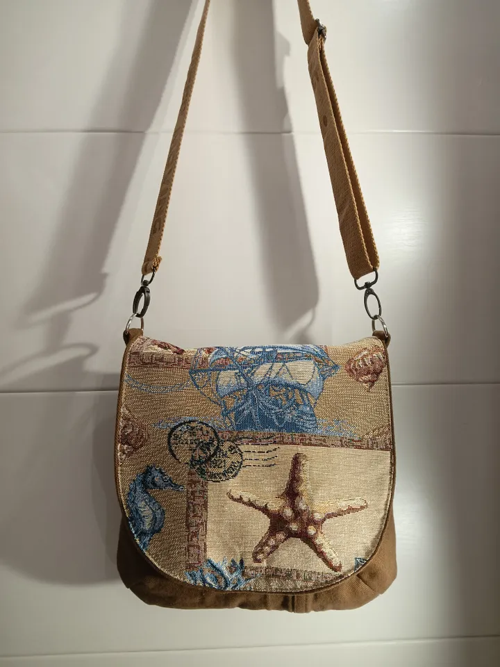 Brown crossbody /shoulder denim bag, a women's messenger bag with a tapestry flap with a marine theme pattern and denim shoulder bag with 4 pockets inside and an adjustable strap.