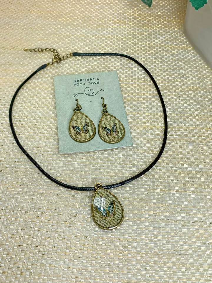 Handmade jewelry set. Shiny butterflies in a bronze frame. designer jewelry.