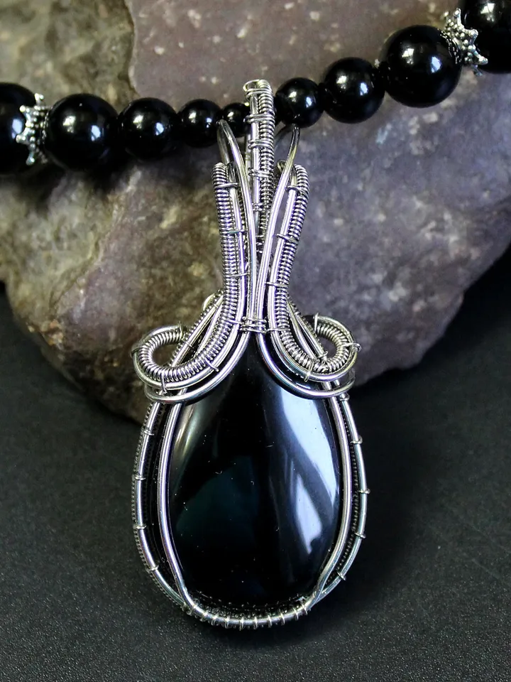 Handmade necklace made of natural stones. Wire wrapped stone pendant.