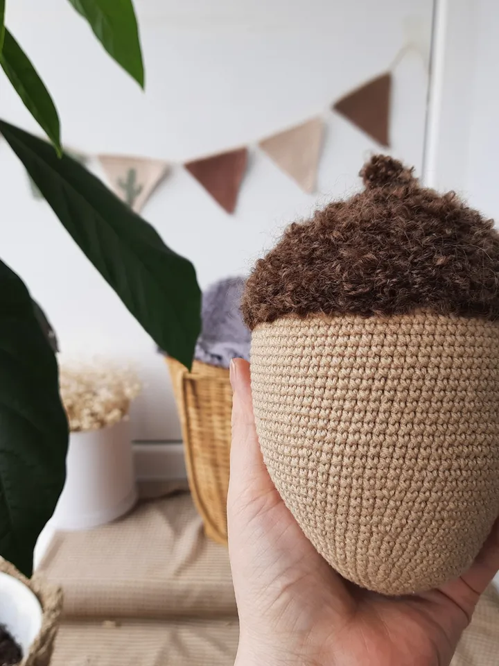 Stuffed biege acorn toy for Home decor. Acorn in Scandinavian style. Decoration of apartments and houses. Universal gift