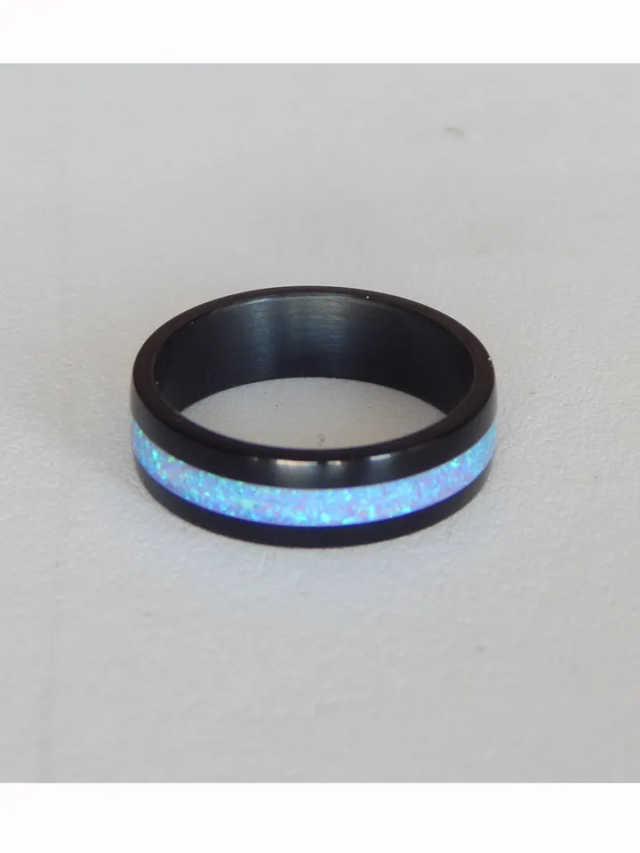 Stylish black ring. Carbon ring with synthetic opal. 7