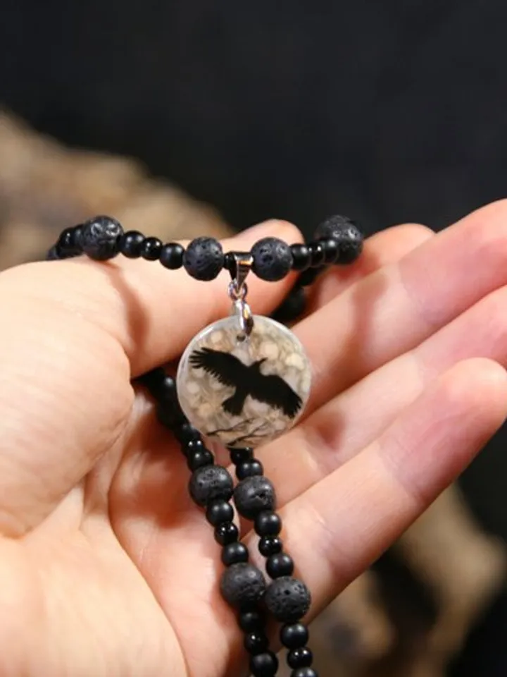 Raven or crow necklace with love rune on the other side. Nacre pearl pendant