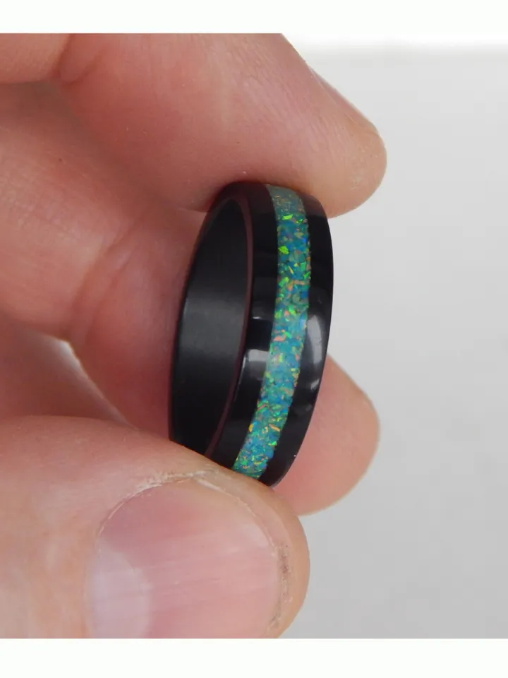 Stylish black ring. Carbon ring with synthetic opal. 9 1/4