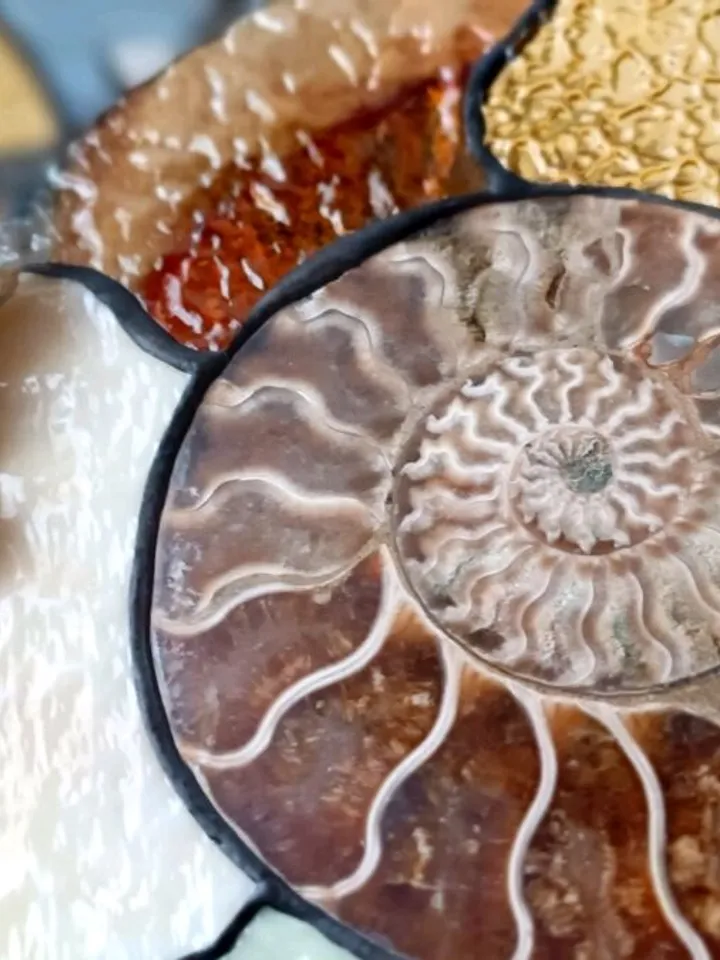Tiffany Stained Glass: Ammonite with Gemstones on a Branch Stand, Artistic Ammonite with Gemstones in Tiffany Style, Ammonite Fossil with Crystals on a Sculptural Stand, Unique Ammonite Stained Glass Art with Gemstones, Decorative Ammonite with Gemstones