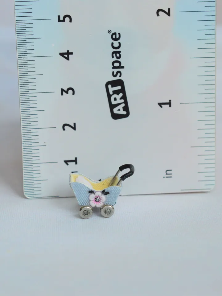 Miniature doll stroller. 1:48 scale. Dollhouse toy. Baby stroller.