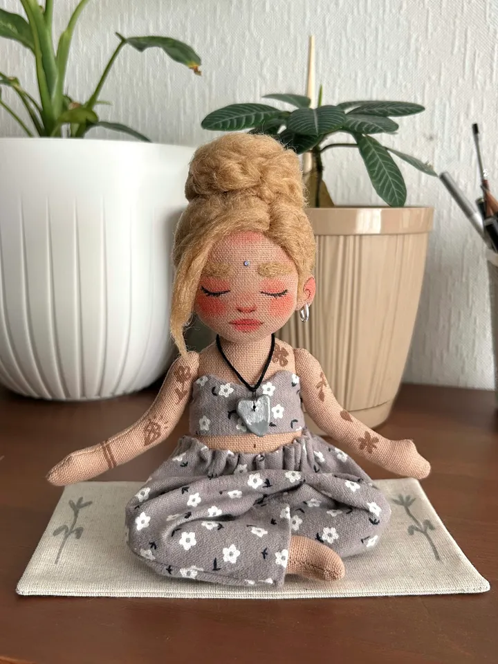Textile doll yoga girl with blonde bun and tattoo
