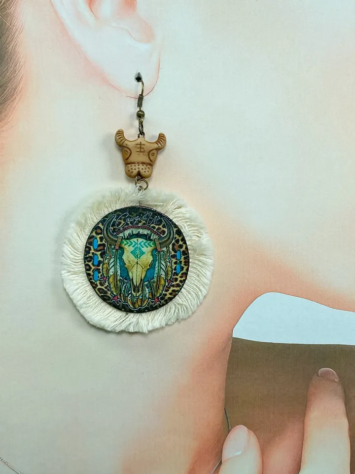 A set of interesting handmade jewelry.Handmade jewelry. Author's design. Set of earrings + pendant on a cord.