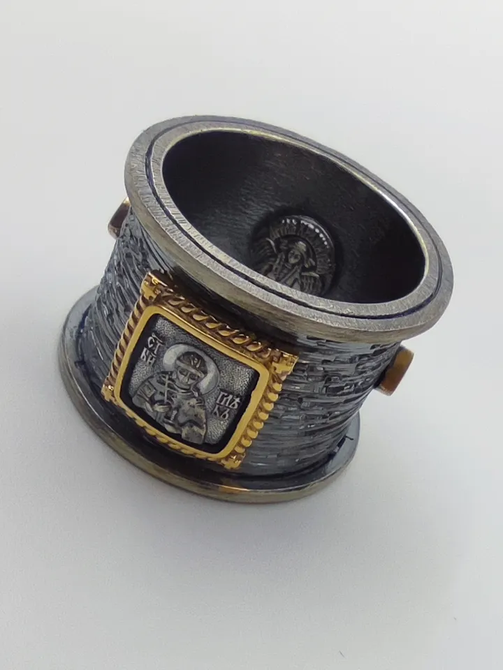 Gorgeous ring with faces of saints