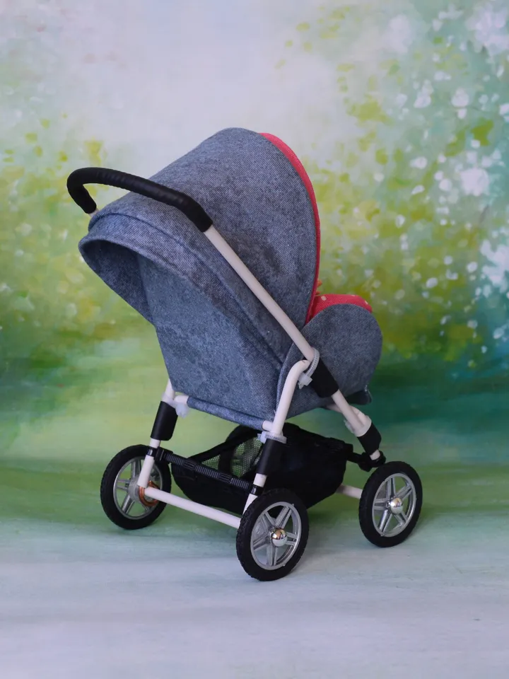 Miniature toy stroller for dolls in 1/6 scale. Accessories for small dolls and poupins. Pram for Barbie doll.