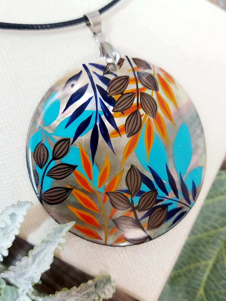 Artistic Expression in Nacre: Abstract Botanical Hand-Painted Mother-of-Pearl Pendant - Captivating Blue and Orange Leaf Motif
