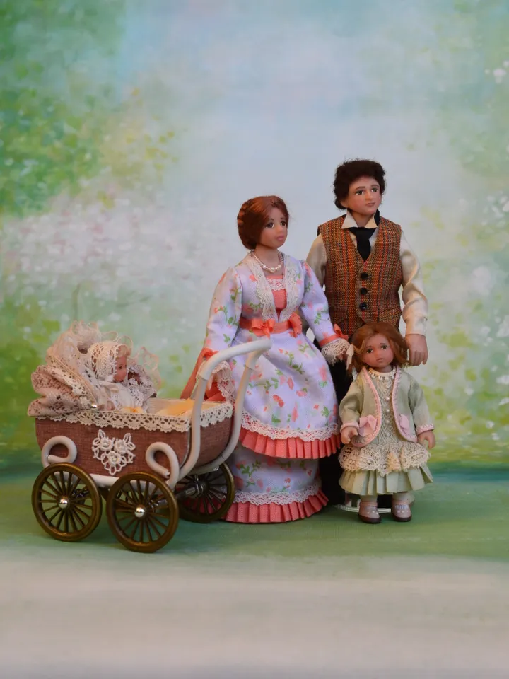 Miniature girl doll for Victorian dollhouse in 1/12 scale.