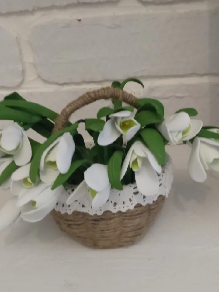 A bouquet of delicate handmade snowdrops in a basket. Mother's day gifts Gifts for her